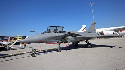A pilot sitting in a Rafale fighter jet at the 2021 Dubai Airshow. AFP