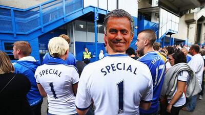 LONDON, ENGLAND - AUGUST 18: A Chelsea fan wears a cardboard cut-out face of manager Jose Mourinho prior to the Barclays Premier League match between Chelsea and Hull City at Stamford Bridge on August 18, 2013 in London, England. (Photo by Clive Mason/Getty Images)