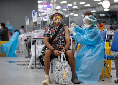A Thai man receives a Covid-19 vaccine during the pandemic. EPA