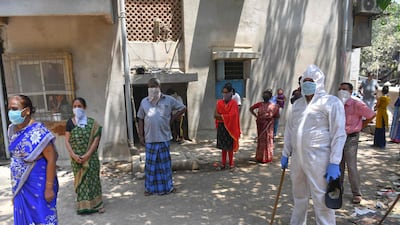 Residents queueing up to get tested for the the Covid-19 coronavirus at the Dharavi slum in Mumbai. AFP