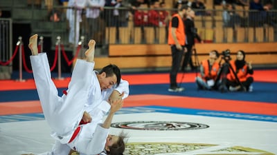 Abu Dhabi, March 4, 2018. Mix Under 21. Marion Decrap from Belgium gets tossed by her partner Ryan Lodens during a match against Italy. Victor Besa / The National Sports
