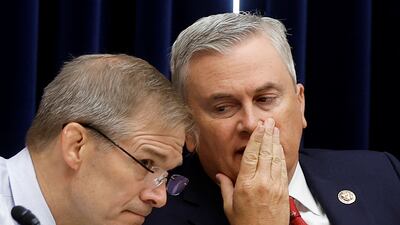 Republicans Jim Jordan and James Comer confer during the hearing. Reuters