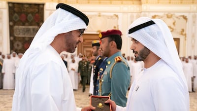 Sheikh Mohamed bin Zayed Al Nahyan, Crown Prince of Abu Dhabi and Deputy Supreme Commander of the UAE Armed Forces, left, presents an Emirates Military Medals to members of the UAE Armed Forces, Ministry of Interior and Abu Dhabi Police, during a Sea Palace barza. All photos by Ministry of Presidential Affairs
