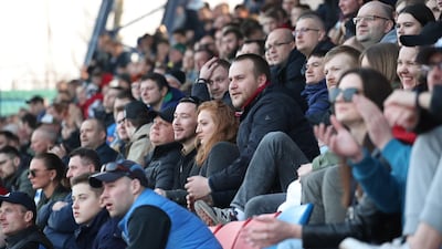 Fans sit packed in the stand. EPA