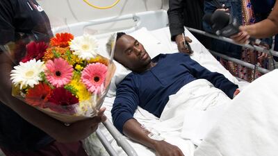 South African triathlete Mhlengi Gwala recovers from surgery in his hospital bed in Durban, South Africa, Friday, March 9, 2018. Khaya Ngwenya /AP Photo