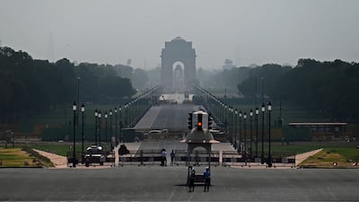 Military police stand guard against the backdrop of India Gate on a hot summer day in New Delhi. AFP