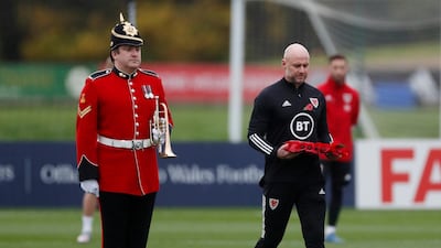 Wales caretaker manager Robert Page during a minute's silence as part of remembrance commemorations. Reuters