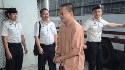 Wirapol Sukphol, a former Thai Buddhist monk, arrives at the Criminal court in Bangkok on August 9, 2018. Dailynews via Reuters