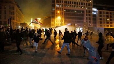 Anti-government demonstrators clash with riot police in Beirut. AP Photo