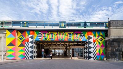 The entrance to Circus West Village with artwork by Morag Myerscough.