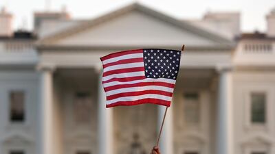 In this September 2017 file photo, a flag is waved outside the White House, in Washington. AP