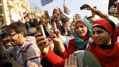 Egyptians use their mobile phones to record celebrations in Cairo’s Tahrir Square, the epicentre of the popular revolt that drove Hosni Mubarak from power in February.