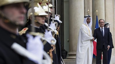 French President Hollande greets Crown Prince of Abu Dhabi as he arrives for a meeting in Paris. Ian Langsdon / EPA