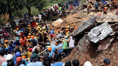 Rescuers search for people trapped in a landslide caused by Typhoon Mangkhut at a small-scale mining camp in Itogon, Benguet, in the Philippines. Reuters