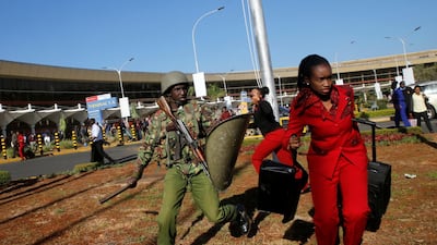 Kenya Airways workers are dispersed by riot police officers at the Jomo Kenyatta International Airport during a labour dispute in Nairobi. Reuters