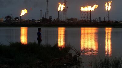 Flames emerge from flare stacks at Nahr Bin Umar oil field, north of Basra, Iraq. Reuters