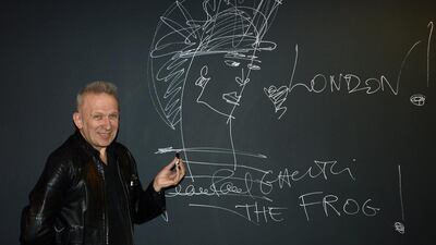 epa04159092 French fashion designer, Jean Paul Gaultier poses for photographers during his new exhibition at the Barbican 'The Fashion World of Jean Paul Gaultier, From the Sidewalk to the Catwalk' in London, Britain, 08 April 2014. The exhibiton will open to the public from 09 April until 25 August. EPA/FACUNDO ARRIZABALAGA