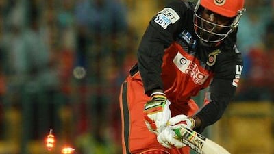 Royal Challengers Bangalore batsman Chris Gayle looks on as he is bowled out for 1 run by Sunrisers Hyderabad Bhuvaneshwar Kumar during the 2016 Indian Premier League(IPL) Twenty20 cricket match between Royal Challengers Bangalore and Sunrisers Hyderabad at The M Chinnaswamy Stadium in Bangalore on April 12, 2016. AFP / MANJUNATH KIRAN