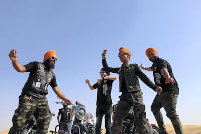 Members of Singhs Motorcycle Club UAE dancing. Photo: Pawan Singh / The National