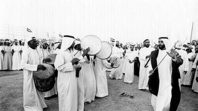 Sheikh Zayed, a visionary rooted in his culture, takes part in a traditional dance. Courtesy National Archives