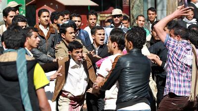 Houthi rebels fight with some of the thousands protesting against the Shia group’s control of Sanaa. Photo: Mohammed Huwais / AFP
