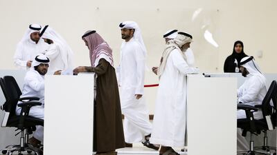 History in the making: Emiratis vote at the Sharjah Cultural and Chess Club in the first UAE local council election. Pawan Singh / The National