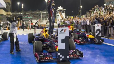 Vettel celebrates his victory at Yas Marina Circuit. He finished 30 seconds ahead of teammate Webber. Christopher Pike / The National