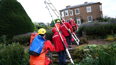 Greenpeace activists approach Prime Minister Rishi Sunak's house in North Yorkshire, to cover it in black fabric in protest at his backing for expansion of North Sea oil and gas drilling. Photo: Greenpeace / PA