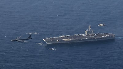 The USS Abraham Lincoln carrier and a US Air Force B-52H Stratofortress, conduct joint exercises in the US Central Command area of responsibility in Arabian sea. US Navy via AP