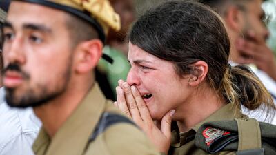An Israeli soldier weeping during the funeral of Staff Sergeant Ori Izhak Iluz, one of three Israeli soldiers killed in a cross-border incident with Egypt on Saturday. AFP