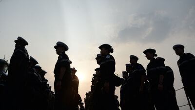 French sailors participate in a ceremony on board the naval ship 'PHA Mistral' off the coast of Goa. AFP