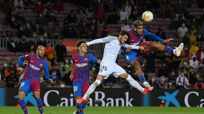 Ronald Araujo of Barcelona competes for the ball with Carlos Neva of Granada. Getty Images