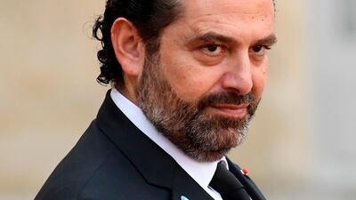 Lebanon's Prime Minister Saad Hariri gestures as he leaves The Elysee Presidential Palace in Paris on September 30, 2019. AFP
