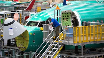 Employees work on Boeing 737 Max planes at the Renton factory in Washington. AFP