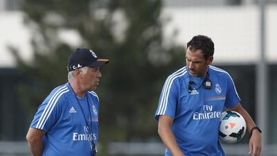 Former Real Madrid coach Carlo Ancelotti, left, talks with his assistant Paul Clement during his first training session at Valdebebas training ground on July 15, 2013 in Madrid, Spain. Angel Martinez/Getty Images