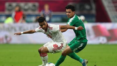 UAE player Abdalla Ramadan in action with Iraq's Ibraheem Bayesh. Reuters