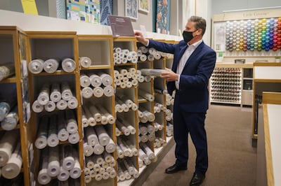 Labour Party leader Sir Keir Starmer appears to mock Boris Johnson by browsing through the wallpaper section at John Lewis in Manchester, England. Getty Images