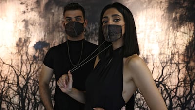 Models present face masks made using aubergine skin by Jordanian chef Omar Sartawi. Reuters