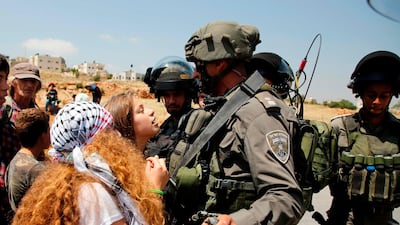 Taken in May 2017, Ahed Tamimi protests in front of Israeli forces in the West Bank village of Nabi Saleh, north of Ramallah, after a demonstration following Friday prayers in solidarity with Palestinian prisoners on hunger strike in Israeli jails. AFP
