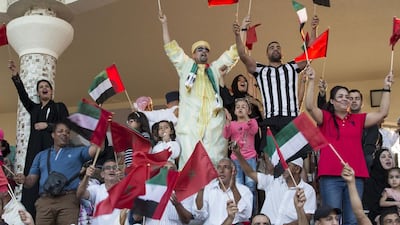Audience members celebrate during a Moroccan equestrian Tbourida show at the Abu Dhabi Equestrian Club during Moroccan Heritage Week. Ryan Carter / Crown Prince Court - Abu Dhabi