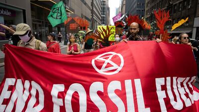 A climate change protest organized by Extinction Rebellion in the Manhattan. A WEF report says phasing out fossil fuel subsidies and building coherence around carbon-based trade policies will encourage decarbonisation. Reuters