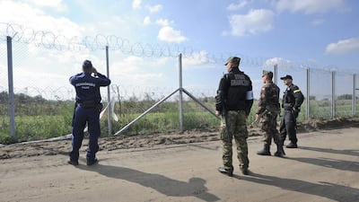 Hungarian and Polish soldiers and policemen guard the Hungarian-Serbian border near Roszke, 180 kms south-east of Budapest, Hungary, on September 20, 2016. Zoltan Gergely Kelemen / EPA