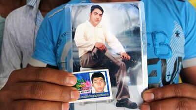 Khurshid Alam (around 26 years old big photo ) and his younger brother Masoud Alam (smaller photo) who died in the Al Ain crash. Pawan Singh / The National