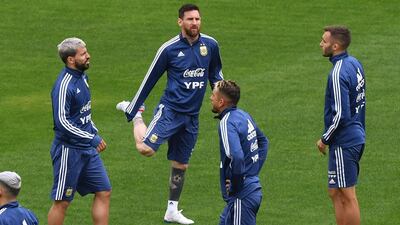 Argentina striker Sergio Aguero, left, goes through a warm-up with Argentina teammates. AFP