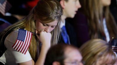 A young Republican supporter shows her disappointment as the results come in during Republican presidential candidate Romney's election night rally. David Goldman / AP