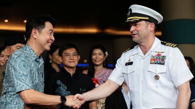 Commanding officer Capt Dan Keeler shakes hands with Poramase Ngampiches, mayor of Pattaya, as the US military crew arrives at Hard Rock Hotel Pattaya for a welcoming ceremony. Reuters