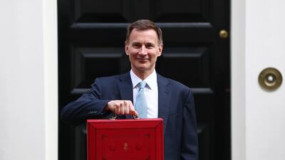Jeremy Hunt, Chancellor of the Exchequer, leaves No 11 Downing Street to deliver his budget to Parliament in London. Getty Images