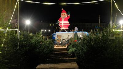 A model of Santa Claus greets shoppers. Sean Gallup/Getty