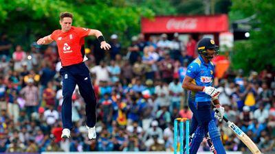 Dasun Shanaka, right, skipped Easter service at St Sebastian's Church in his hometown of Negombo because of a long trip the day before. Lakruwan Wanniarachchi / AFP