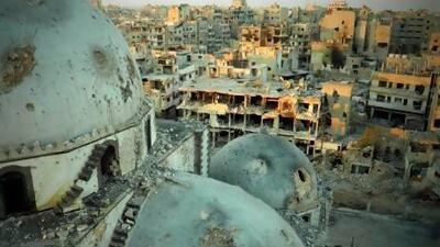 The Khaled bin Walid mosque, whose mausoleum has been partially destroyed by Syrian army shelling, in the Al Khalidiyah neighbourhood of Homs.